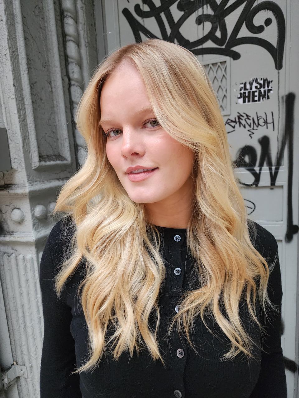 Stylist finishing a luxe blowout