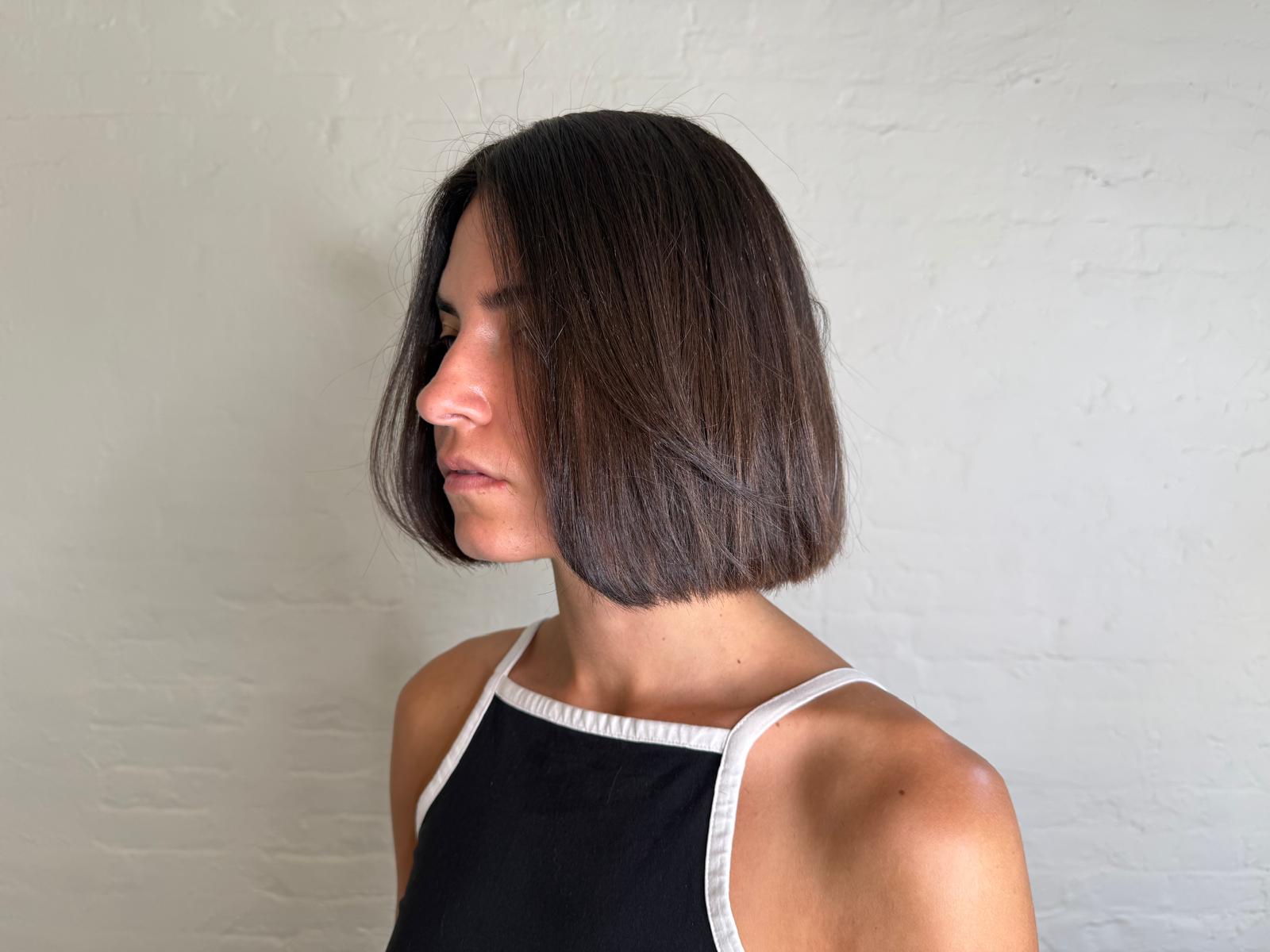 Sharp chin-length blunt bob on dark brown hair, cut at Williamsburg Salon in Brooklyn