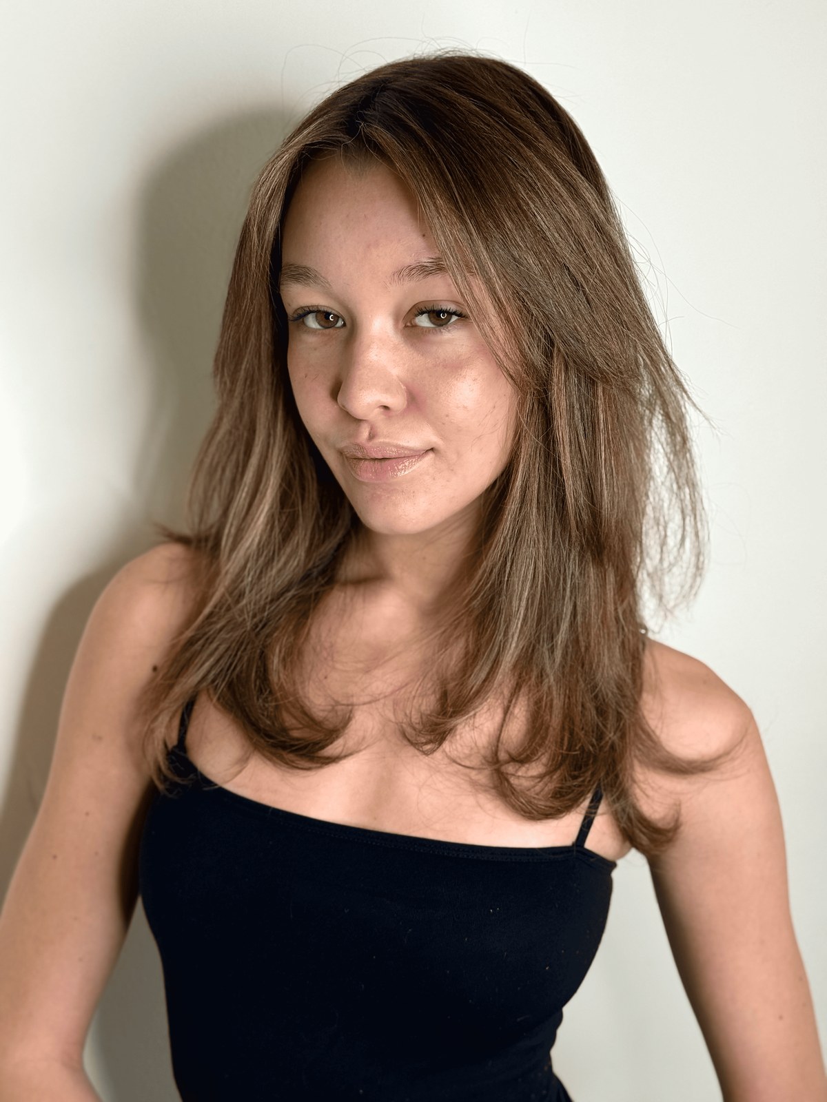 Mid-length haircut with soft face-framing layers on light brown hair at Williamsburg Salon