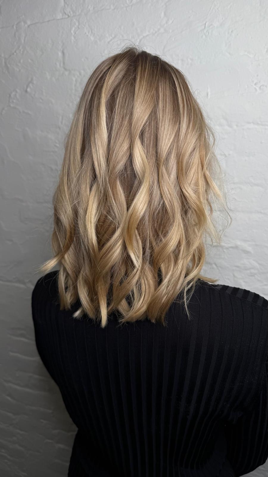 Golden copper balayage on long waves, Williamsburg Salon