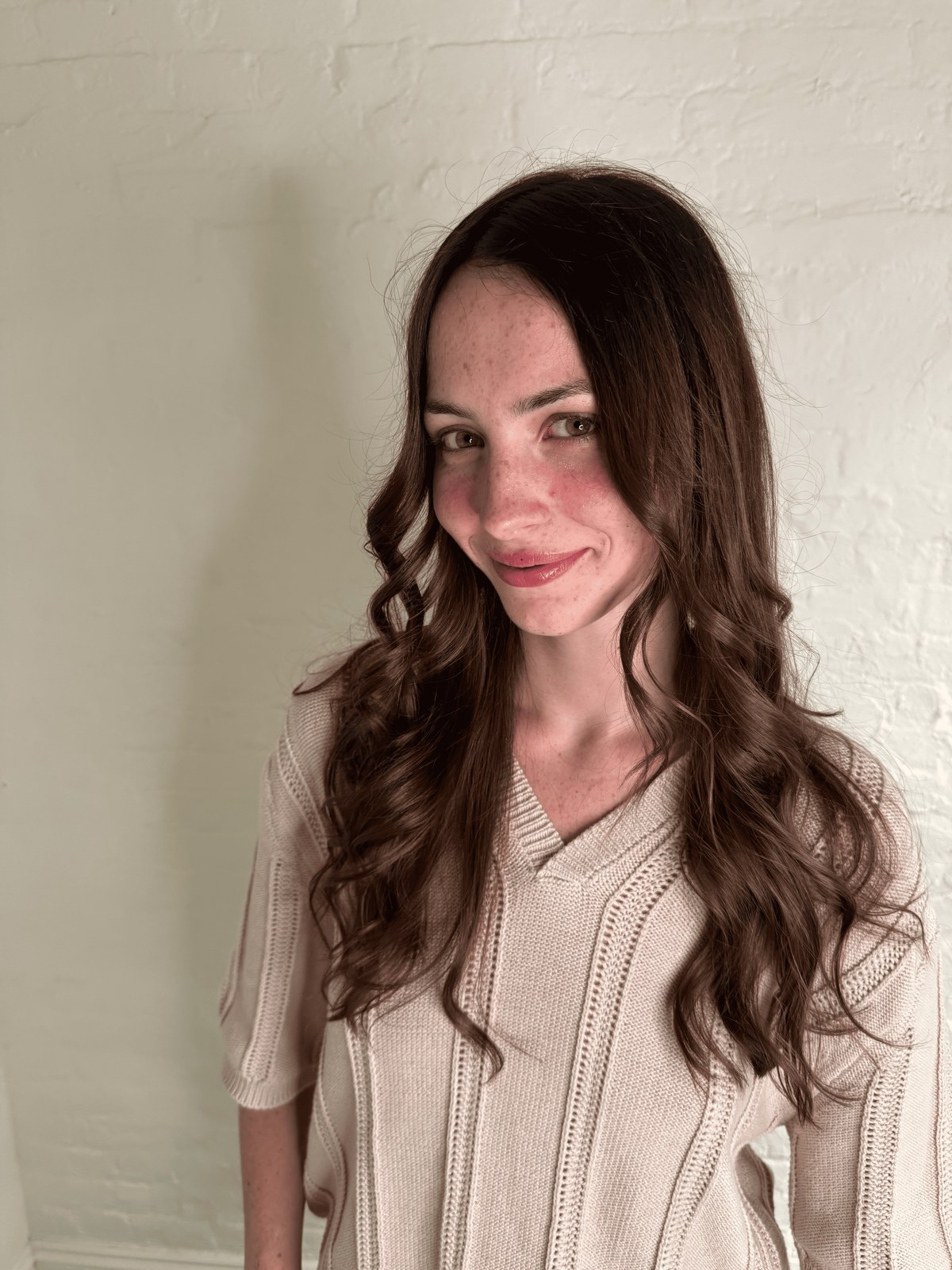 Warm brunette waves with subtle face-framing brightness, Williamsburg Salon